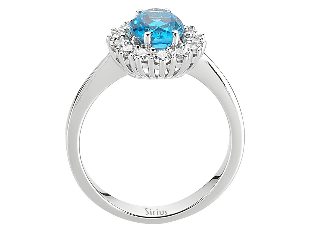 Diamond and Oval Blue Topaz Ring in 14 K White Gold