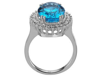 Diamond and oval cut blue topaz ring in 14 carat white gold