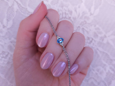 Bracelet with diamonds and oval blue topaz