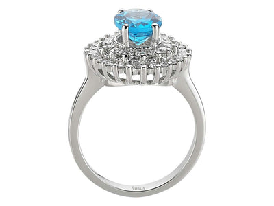 Diamond and oval blue topaz ring in 14 K white gold