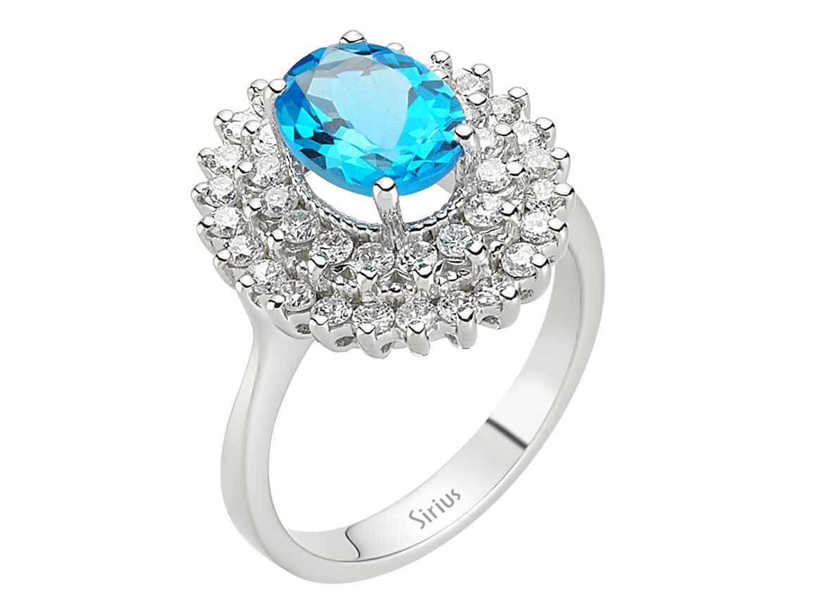 Diamond and oval blue topaz ring in 14 K white gold