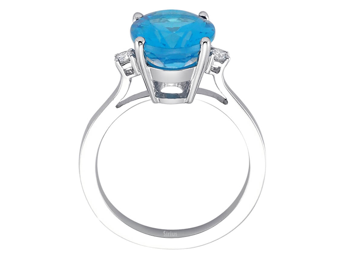 Diamond and oval blue topaz ring in 14 carat white gold