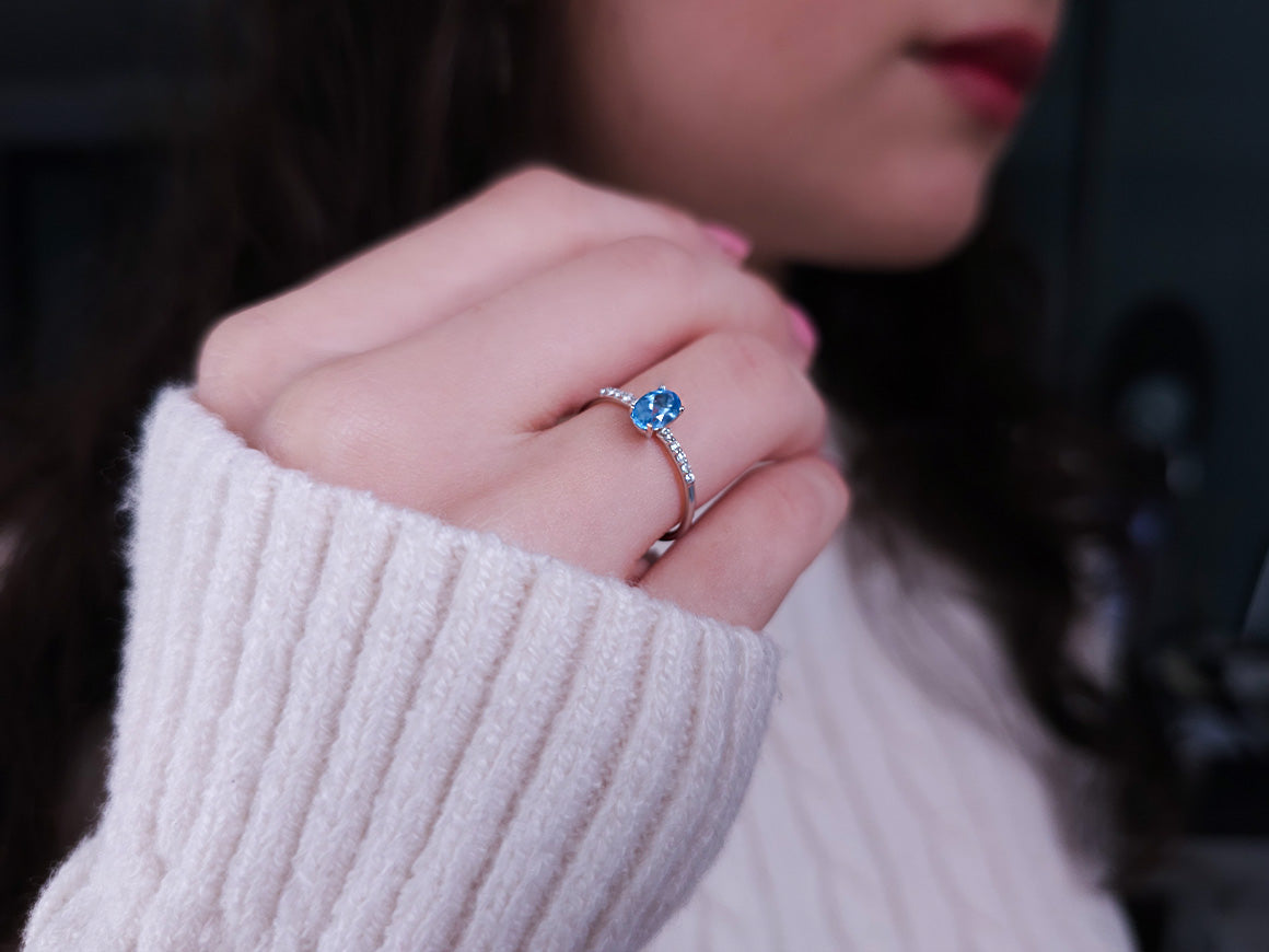 Diamond and Oval Blue Topaz Ring