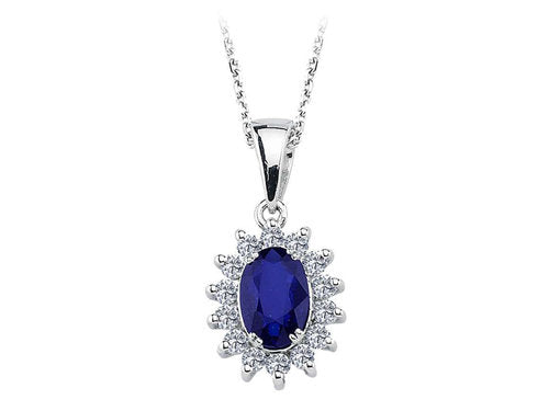 Diamond and oval sapphire jewelry set in 14 K white gold