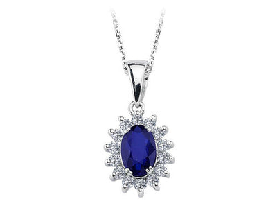 Diamond and oval sapphire jewelry set in 14 K white gold