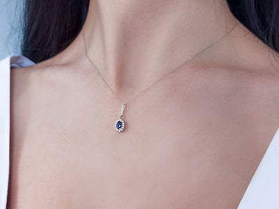 Diamond and oval sapphire pendant