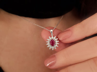 Diamond and oval ruby necklace in 18 K white gold