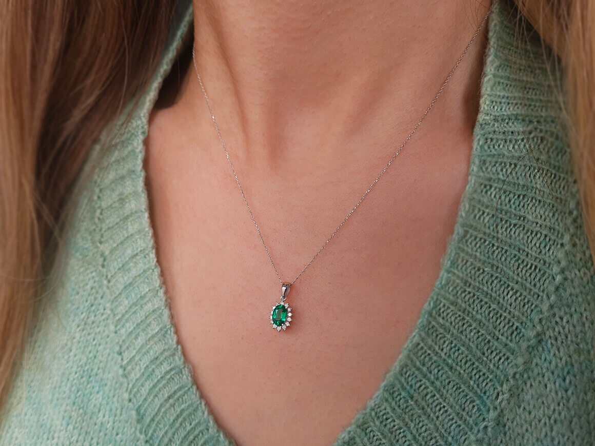 Diamond and oval emerald necklace