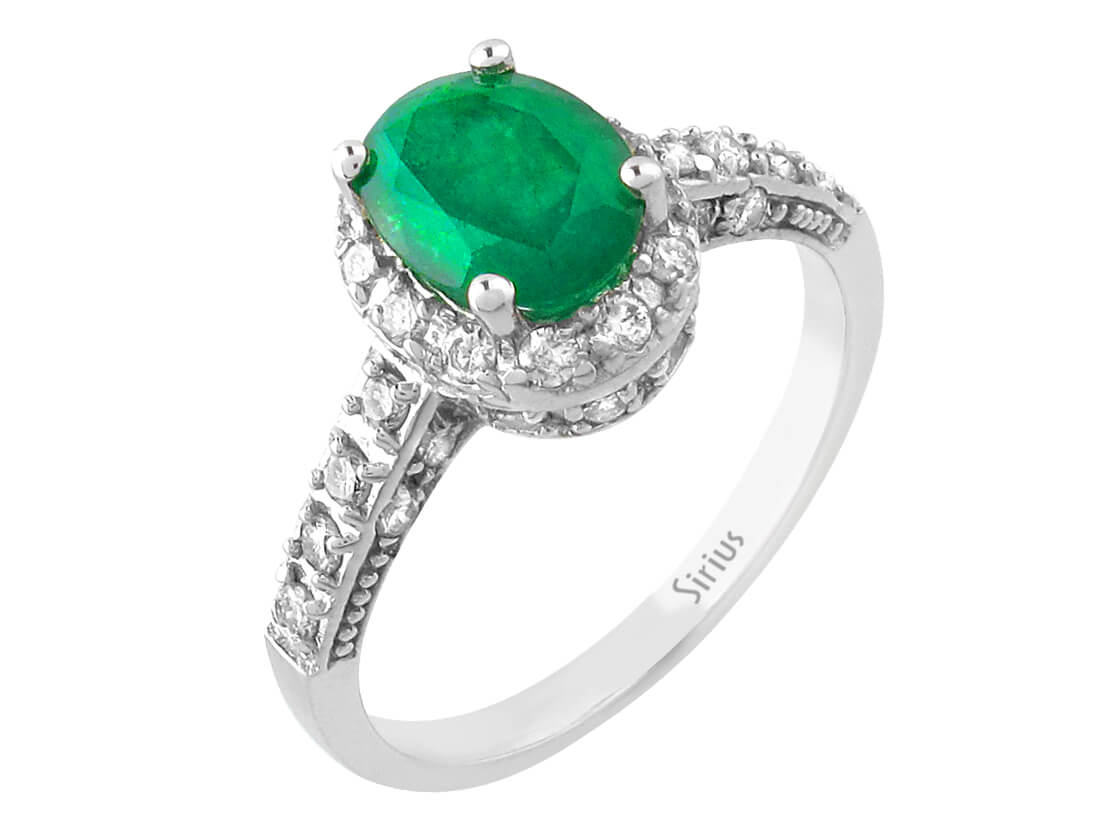 Ring with diamonds and oval emeralds