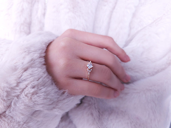 Princess-cut white sapphire ring with diamonds