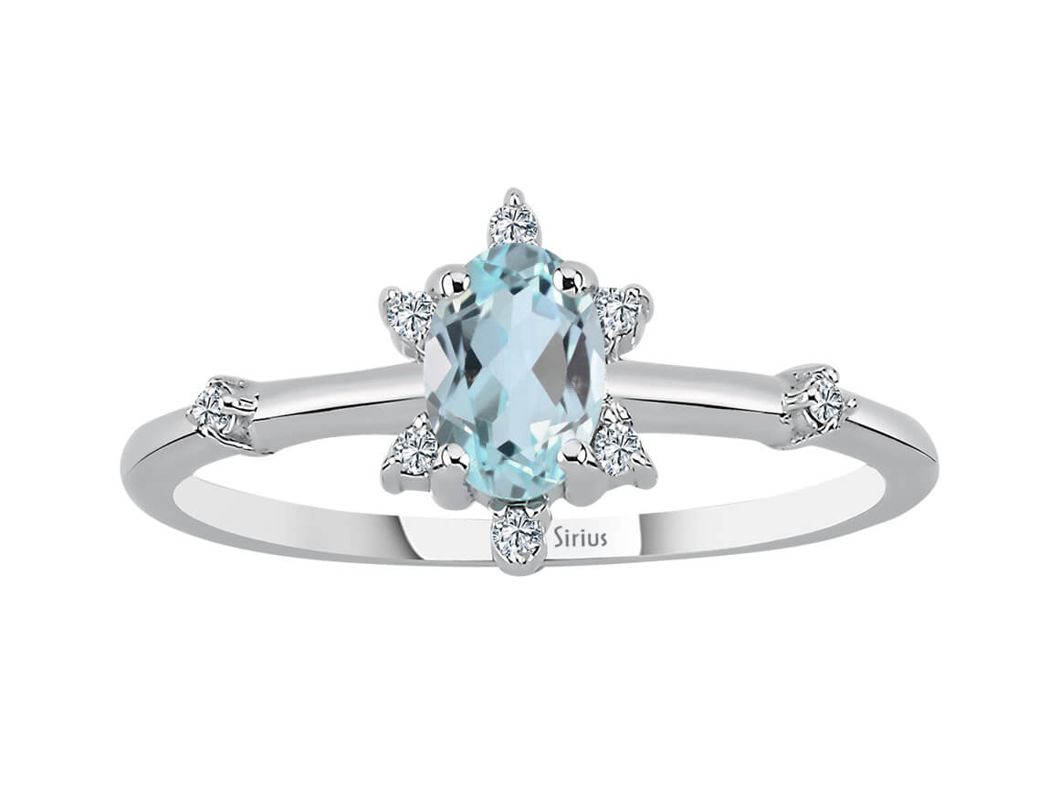 Eiskristall Ring mit Diamant und himmelblauem Topas - handgefertigter Diamantschmuck aus Feingold | Sirius Diamant