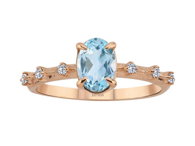 Elena ring with diamonds and sky blue topaz stones