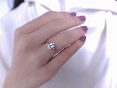 Elena ring with diamonds and sky blue topaz stones