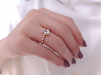 Elena ring with diamonds and sky blue topaz stones