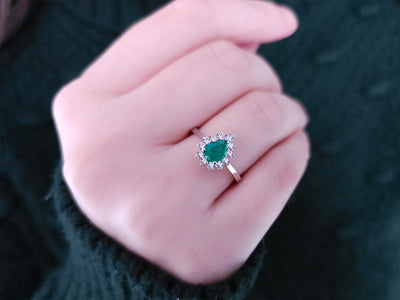 Diamond and drop emerald ring in 14 K white gold