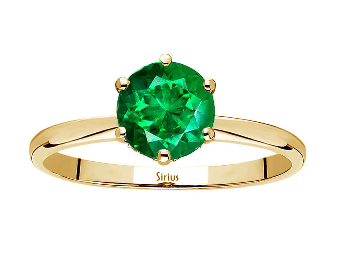 Diamond and emerald plano ring in 14 K yellow gold