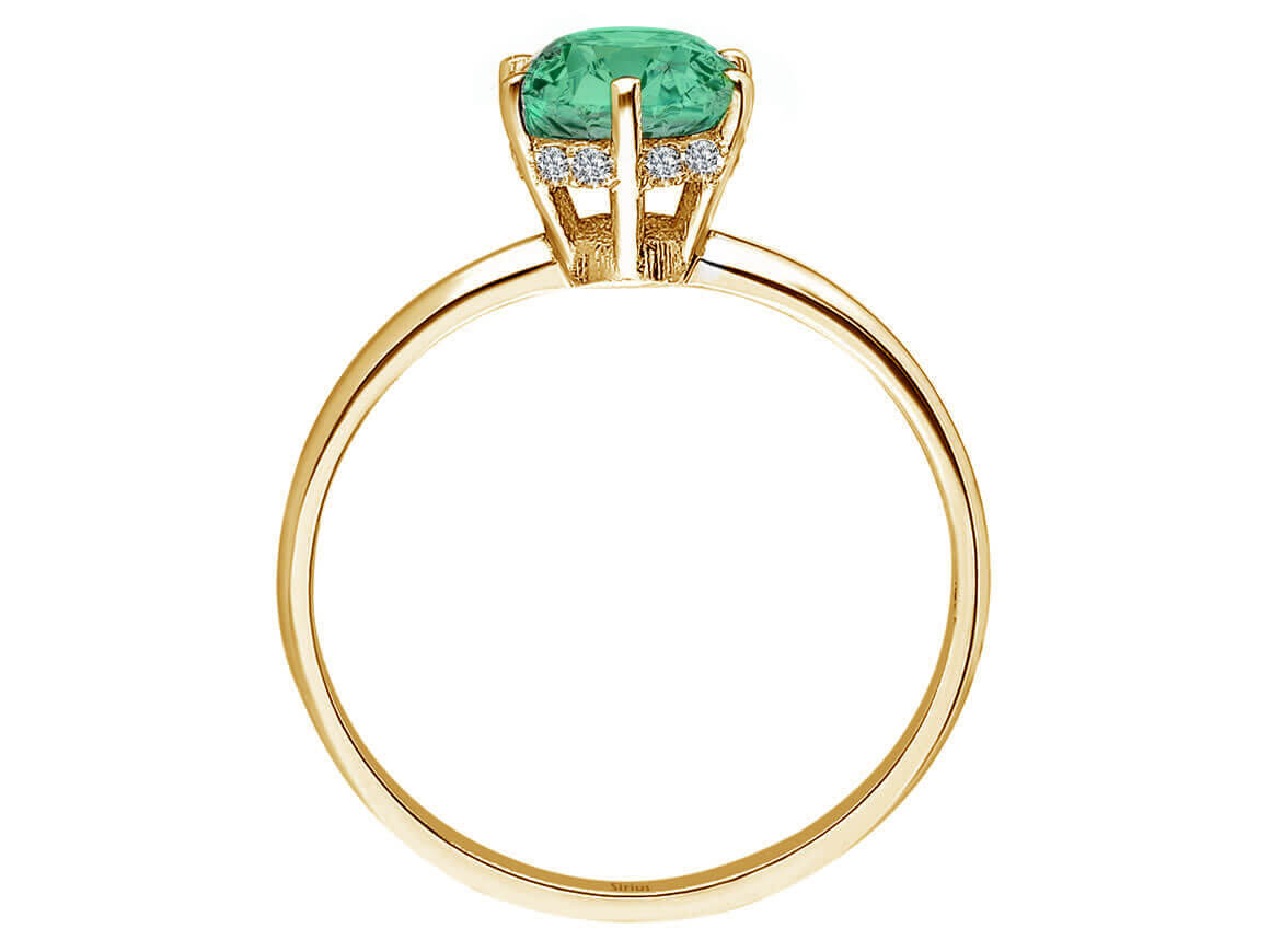 Diamond and emerald plano ring in 14 K yellow gold