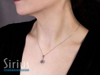 Two-row diamond and ruby flower necklace in 14 K white gold