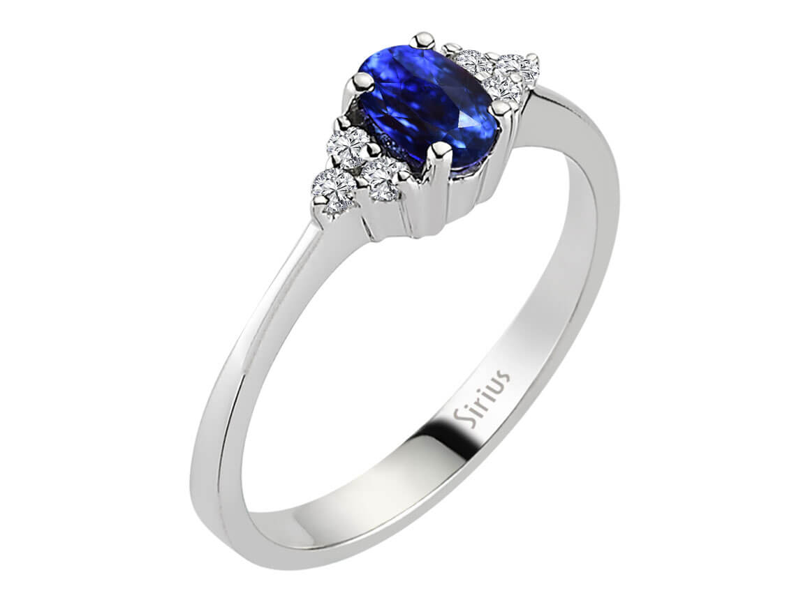 Diamond and oval sapphire ring in 333 8K white gold