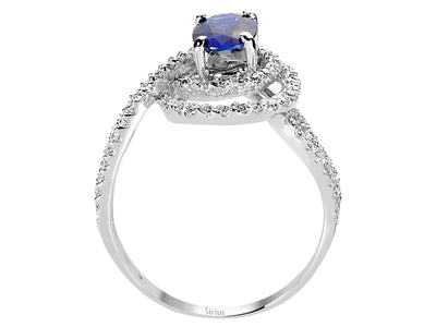 Diamond and oval sapphire ring in 14 carat white gold