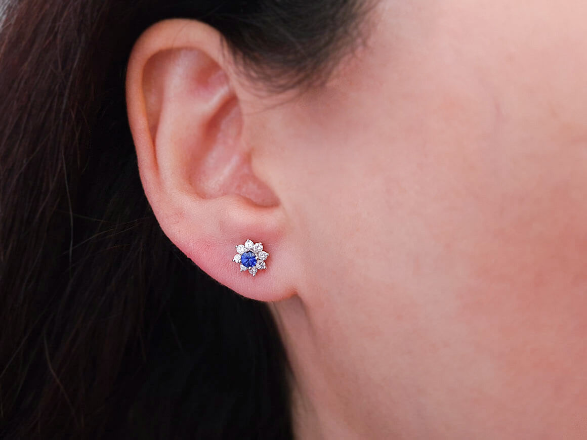 Diamond and sapphire stud earrings in 14 K white gold