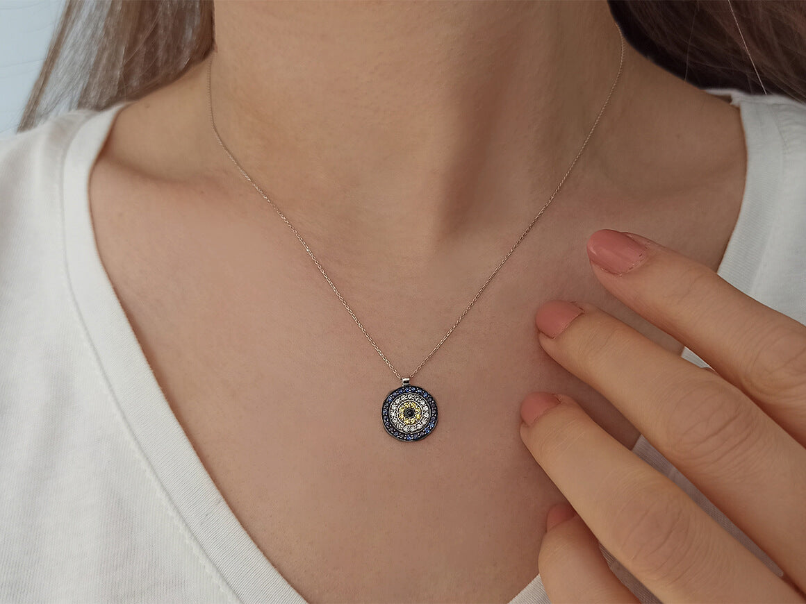 Diamond and sapphire "Blue Eye" motif necklace in 14K