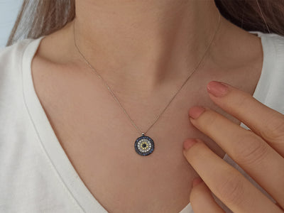 Diamond and sapphire "Blue Eye" motif necklace in 14K