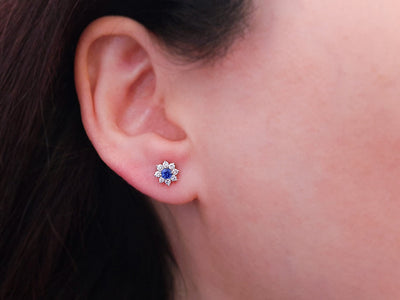 Diamond and sapphire stud earrings in 14 K white gold