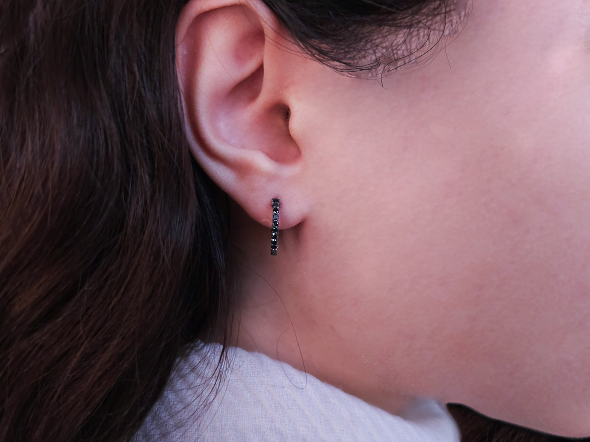 Black diamond earrings in 14 carat white gold