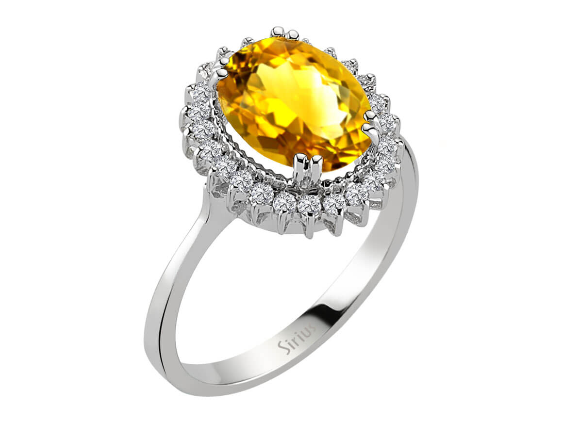 Diamond and oval citrine ring in 14 carat white gold