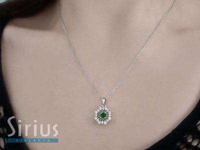 Diamond and emerald sunray necklace in 14 K