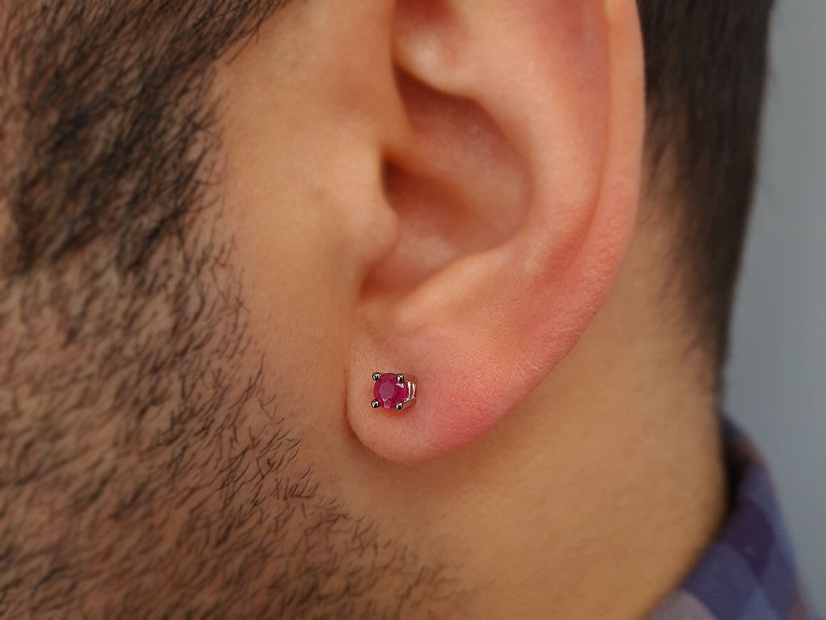 0.33 carat ruby solitaire men's earring in 14K white gold 