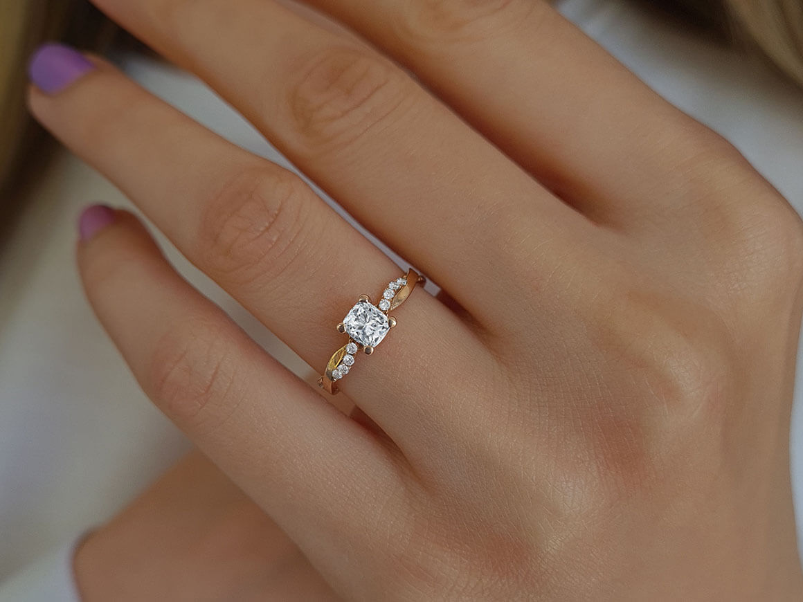 0.60 total carat diamond cushion cut solitaire ring in 14 K rose gold