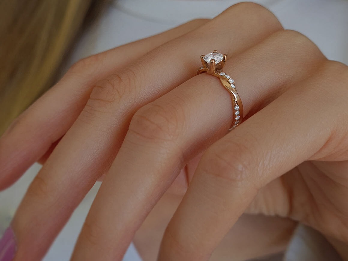 0.60 total carat diamond cushion cut solitaire ring in 14 K rose gold