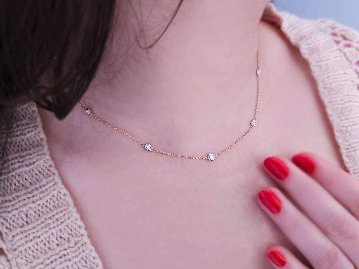 0.62 carat diamond 11 stone necklace in 14 carat red and white gold